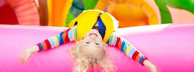 Kids tackling the Monster Jump inflatable obstacle course