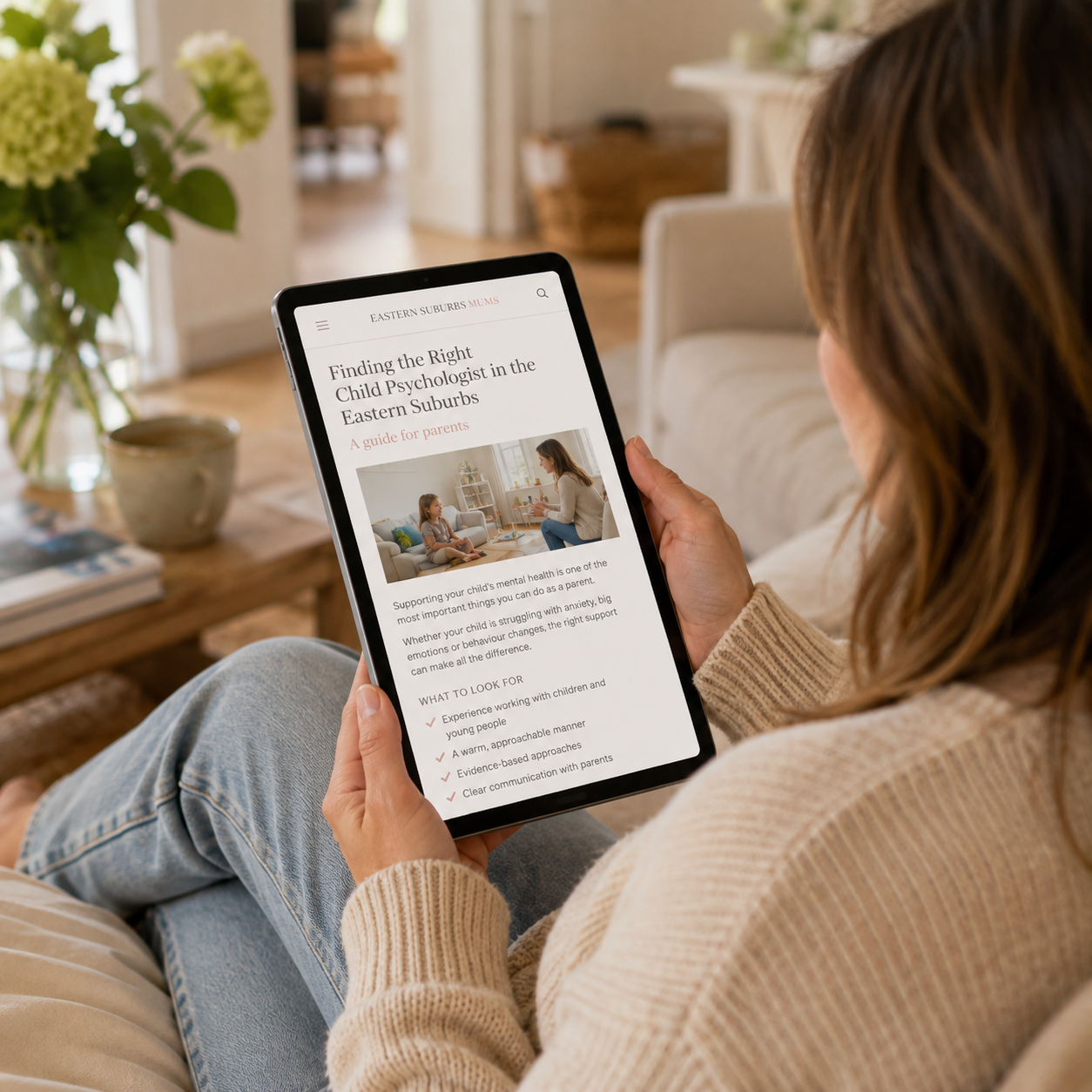 Parent reading an Eastern Suburbs Mums article about finding the right child psychologist